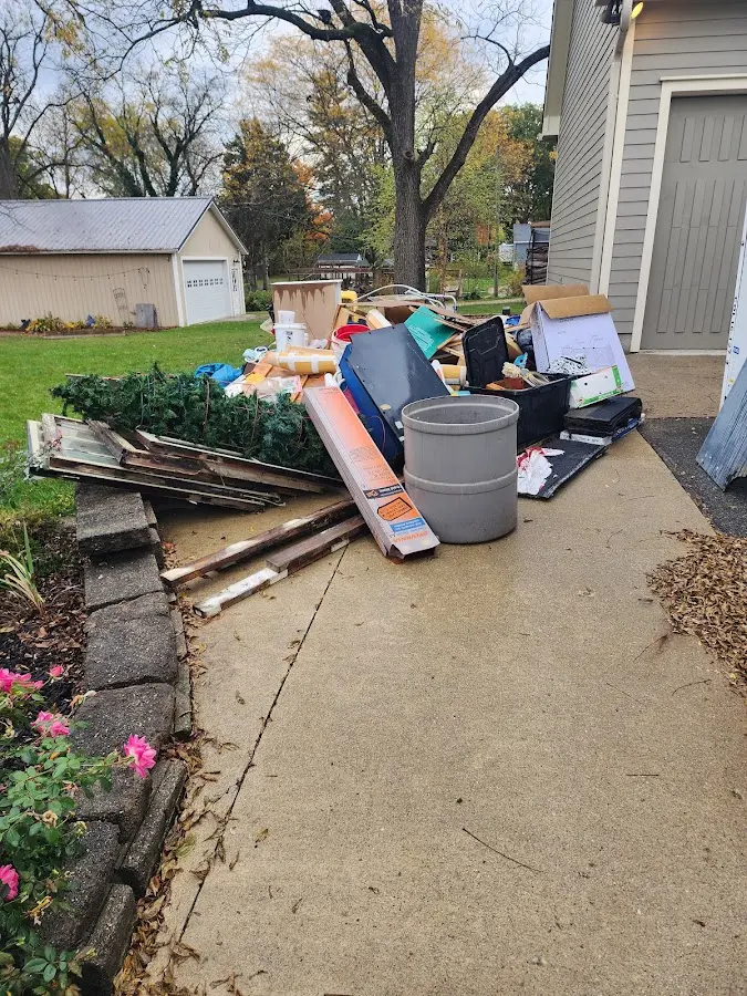 Dumpster being loaded with debris for 3 Yard Dumpster Rental in Moultrie
